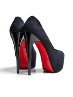stock-photo-close-up-of-female-high-heeled-shoes-over-white-background-110909420